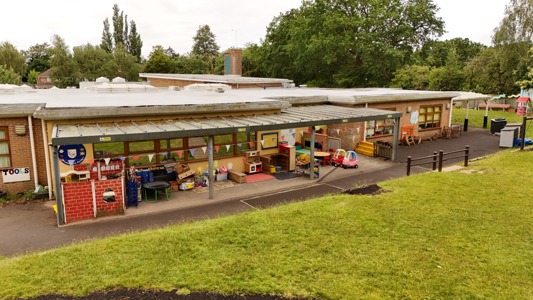Low aerial of an outdoor classroom canopy and play area